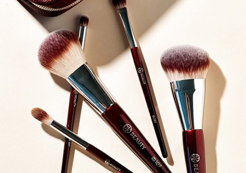BK Beauty Travel Brush Set featuring the travel version of T101 Contoured Foundation Brush, T107 Flat Blush Brush, T202 Defined Crease Brush, T203 Eyeshadow Shader Brush, and T207 Pencil Blender Brush, as well as a vegan leather pouch in oxblood red color